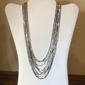 Multi strand silver tone necklace